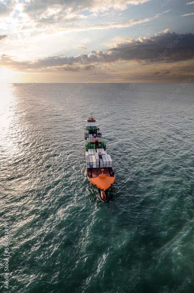 Obraz premium Impressive aerial wide angle view of a container ship crossing the oceans