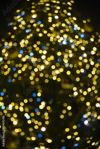 Colorful Red  Yellow and Green Christmas Tree Bokeh background of de focused glittering lights  Christmas background pattern concept.