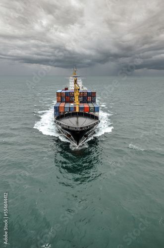 Impressive aerial wide angle view of a container ship crossing the oceans