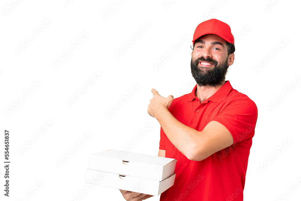 Pizza delivery man with work uniform picking up pizza boxes over isolated chroma key background pointing back Pizza delivery man with work uniform picking up pizza boxes over isolated chroma key background pointing back