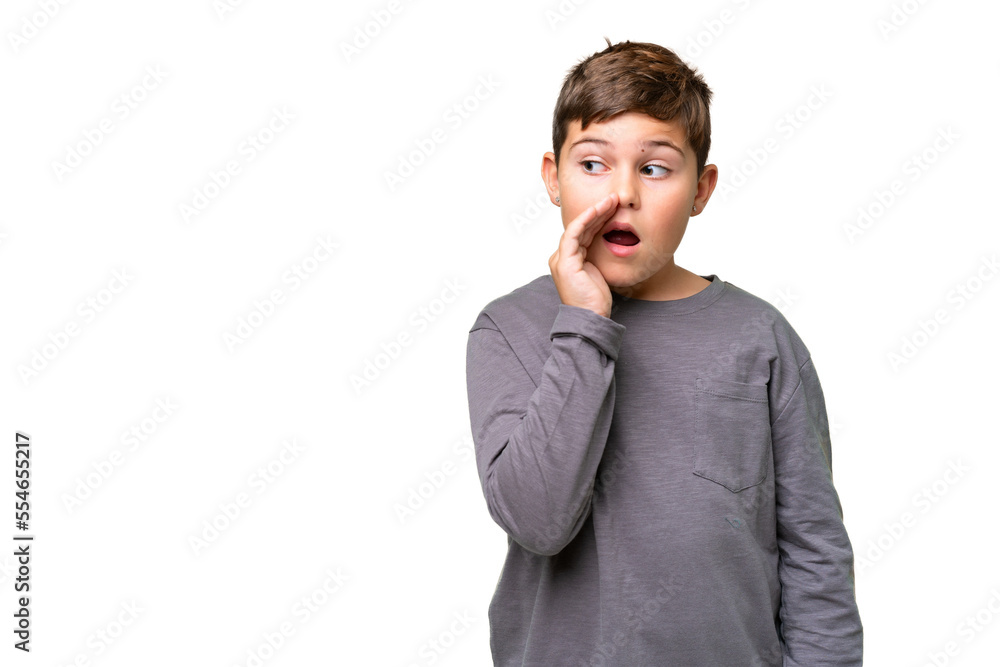Little caucasian kid over isolated chroma key background whispering something with surprise gesture while looking to the side Little caucasian kid over isolated chroma key background whispering something with surprise gesture while looking to the side