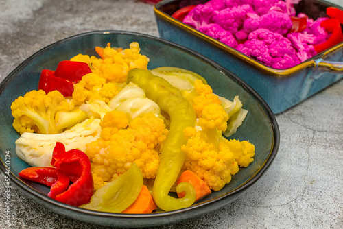 Homemade pickle with yellow and purple cauliflower