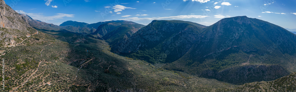 Aerial view of the mountains and the village of Delphi in Greece on a sunny day.	