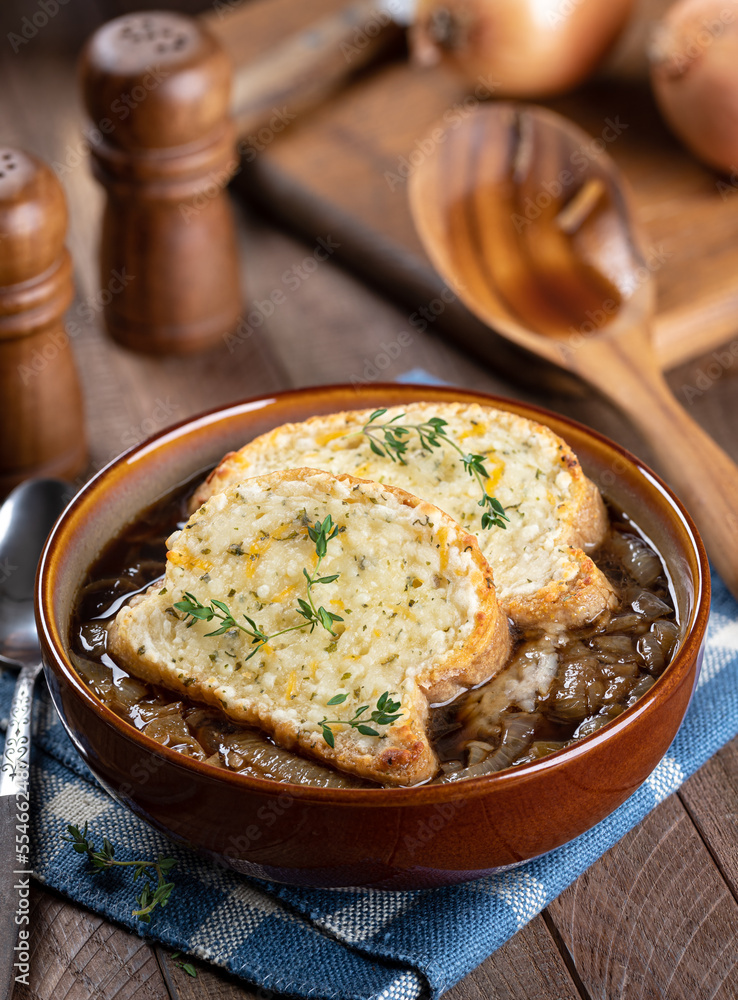 French onion soup with toasted cheese baguette garnished with thyme French onion soup with toasted cheese baguette garnished with thyme