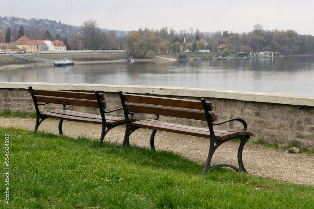 Two wooden benches in front of the Danube river in Szentendre