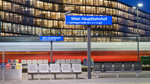 Obraz na płótnie Vienna central station Hauptbahnhof sign on train platform, at night. Main railway transportation hub in Wien, Austria. w salonie
