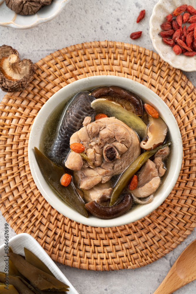 Delicious Taiwanese peeled green chili pepper chicken soup with mushroom and goji berry.