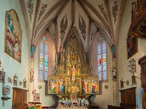 interior of the Church "St. Vigil" in Altenburg/Castelvecchio - Kaltern - View on the winged altar, a neo-Gothic artwork - Caldaro, South Tyrol, Italy - december 17, 2022
