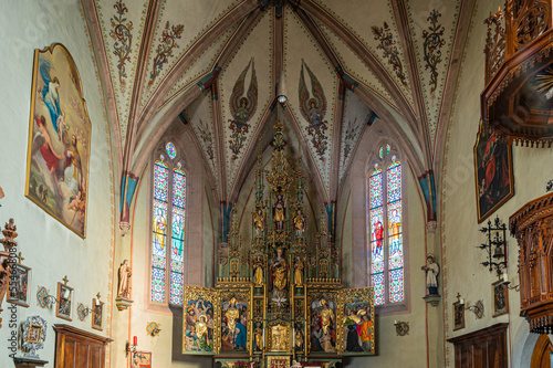 interior of the Church "St. Vigil" in Altenburg/Castelvecchio - Kaltern - View on the winged altar, a neo-Gothic artwork - Caldaro, South Tyrol, Italy - december 17, 2022