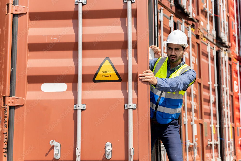 male engineers in a container shipping company Consulting to check the order for the container that is responsible male engineers in a container shipping company Consulting to check the order for the container that is responsible