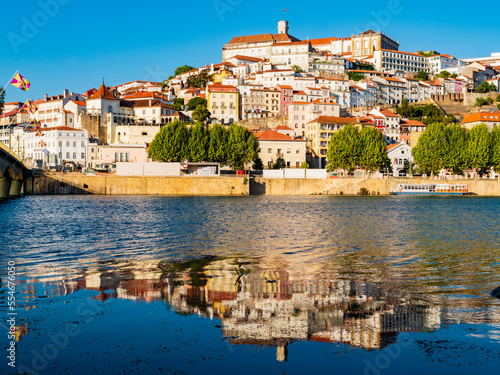 Fototapeta Naklejka Na Ścianę i Meble -  Stunning skyline of Coimbra reflected in Mondego river, Portugal