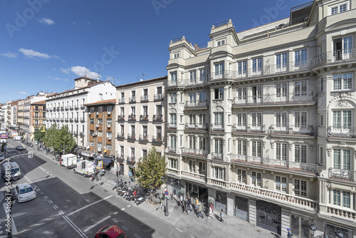 Facades of residential buildings in Atocha street in Madrid, Spain