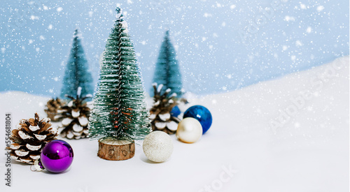 Christmas tree decor on a blue background. New Year s card with snow