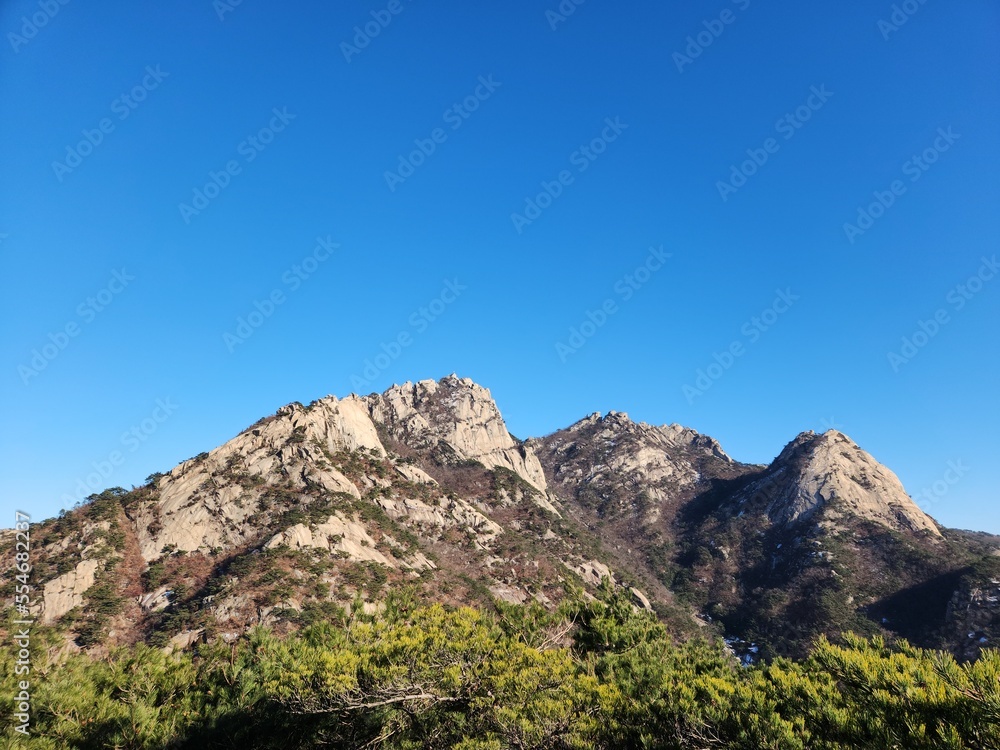 magnificent mountain landscape. Hiking and mountaineering. Mountain paths and stone steps. peak. Seasons in the mountains: autumn - winter - spring - summer. Hiking in the mountains