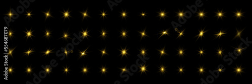 Glowing lights and stars on black background.