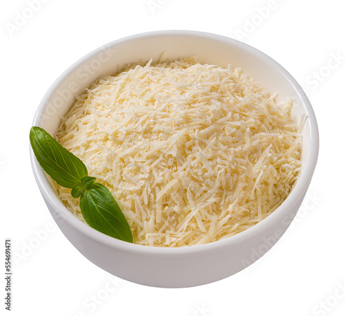 Bowl of shredded parmesan cutout. Grated grana padano cheese in a white bowl isolated on a white background. Delicious hard cheese prepared for cooking. Italian dairy product.