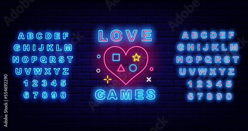 Love games neon sign on brick wall. Light label. Heart with joystick icons. Luminous blue alphabet. Vector illustration