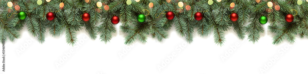 New Year's decor from branches of a Christmas tree and New Year's toys with lights of light bulbs, snow and bokeh isolated on a white background, copy space
