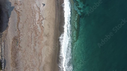 Blue sea waves hitting the beach