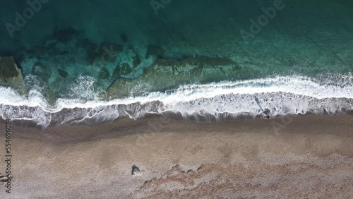 Blue sea waves hitting the beach