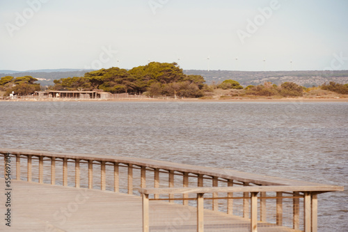 Wooden boardwalk on the beach of Leucate in the south of France in Languedoc Roussillon in France. Mediterranean sea with space for text. Landscape in Luecate  Aude. 