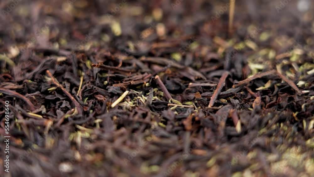 Thyme black tea dried leaves falling in slow motion. Medicinal herb drink. Rotation Thyme black tea dried leaves falling in slow motion. Medicinal herb drink. Rotation
