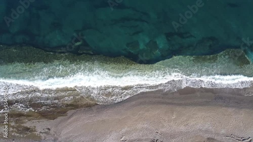 Blue sea waves hitting the beach