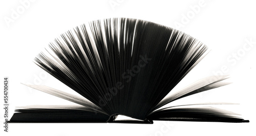 The pages of an open book are directed upwards and illuminated. The book in the backlight. png. The concept of education, scientific work, reading.