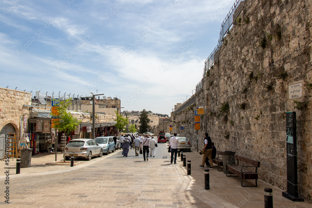 Zion Gate street in old city of Jerusalem - Israel: 22 April 2022. Tourists walking in old streets of Jerusalem.