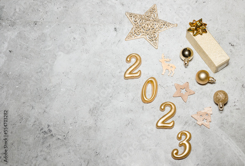 happy new year 2023 background new year holidays card with bright lights,gifts and bottle of hampagne