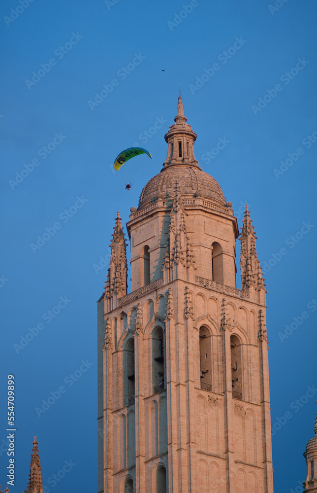 Parachuter going next to a church