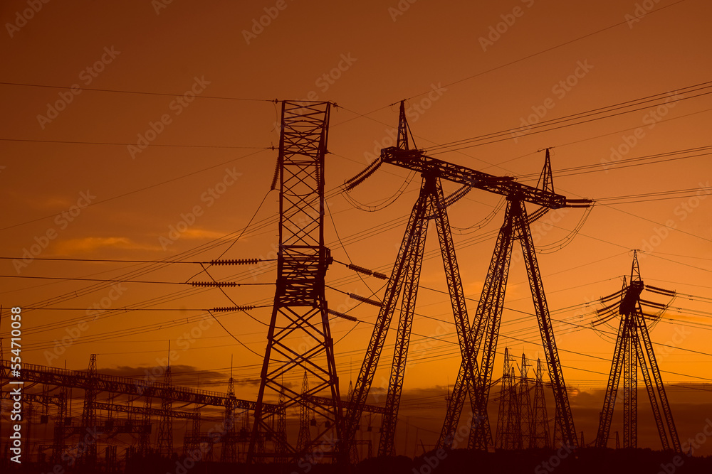 High voltage electric power station,substation with transformers and sky background.high voltage post,High voltage tower sky sunset.