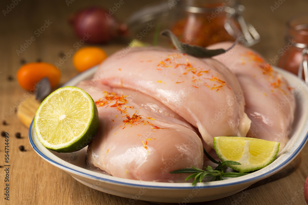 Dietary chicken breast with saffron, lime and kumquat, close-up Dietary chicken breast with saffron, lime and kumquat, close-up