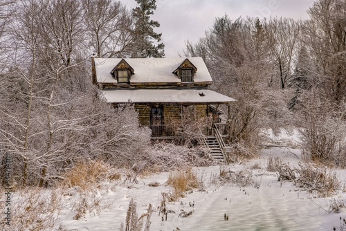 wooden house in the snow