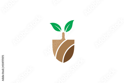 Shovel spade scoop logo with leaf in brown and green design color