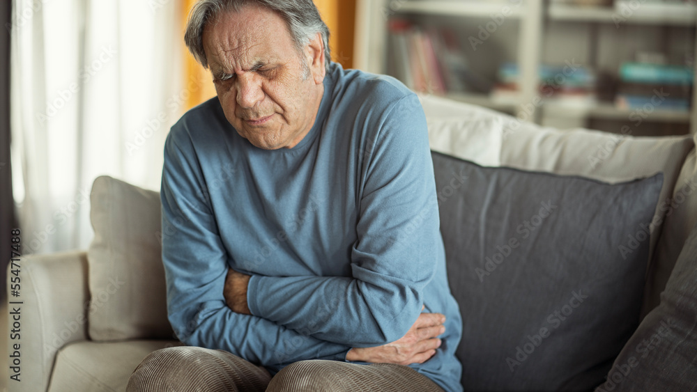 Senior man with stomach pain Senior man with stomach pain