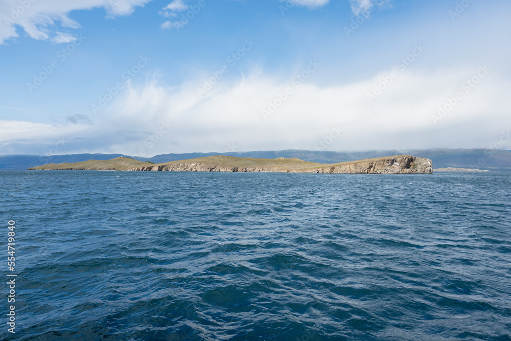 Ogoy is the island in Baikal lake. View from water Ogoy is the island in Baikal lake. View from water