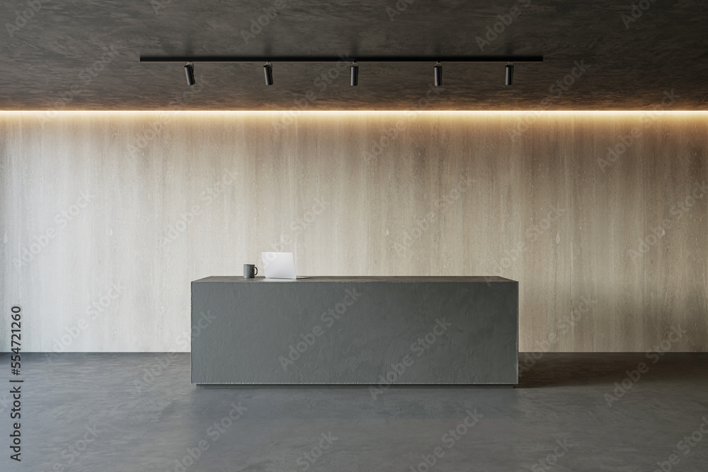Front view on modern minimalistic reception desk with modern laptop in empty stylish office area, dark lamp on wooden wall background. 3D rendering