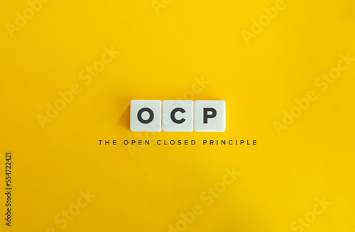 The Open Closed Principle (OCP) Banner. Object Oriented Design. Block Letter Tiles on Yellow Background. Minimal Aesthetics.
