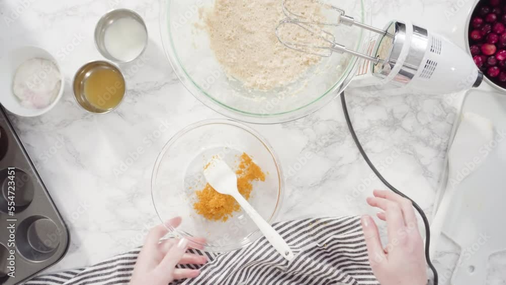 Flat lay. Step by step. Mixing ingredients in a mixing bowl to bake cranberry muffins. Flat lay. Step by step. Mixing ingredients in a mixing bowl to bake cranberry muffins.