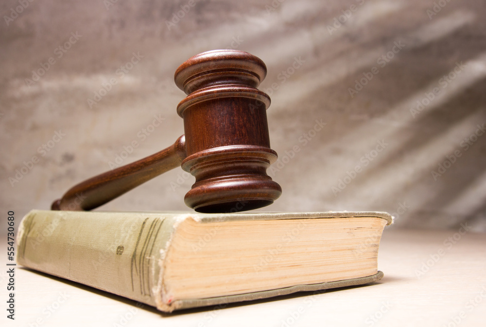 Law and justice concept. Mallet gavel of the judge, scales of justice, books. Copy space for text