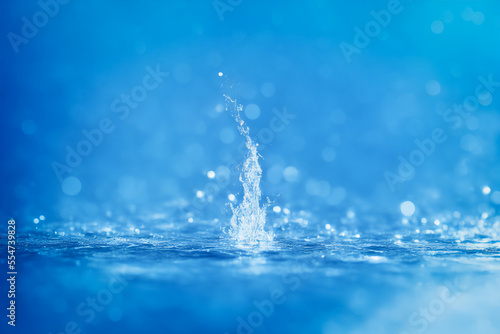 refreshing water falling or splash with blur bokeh background and soft light 