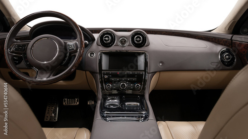 Modern car inside. Multimedia screen and panel with control buttons.