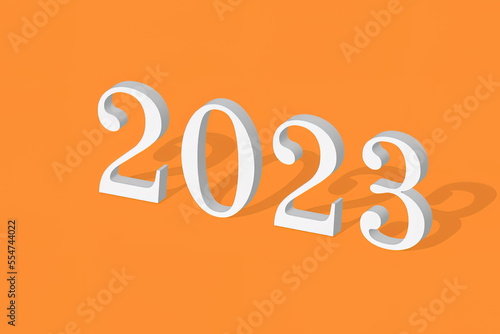 2023 white 3D sign on orange background with a shadow