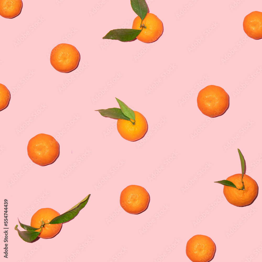 Tangerine pattern on pastel light pink background. Minimalistic fruit concept. Creative summer nature composition. Tangerine pattern on pastel light pink background. Minimalistic fruit concept. Creative summer nature composition.