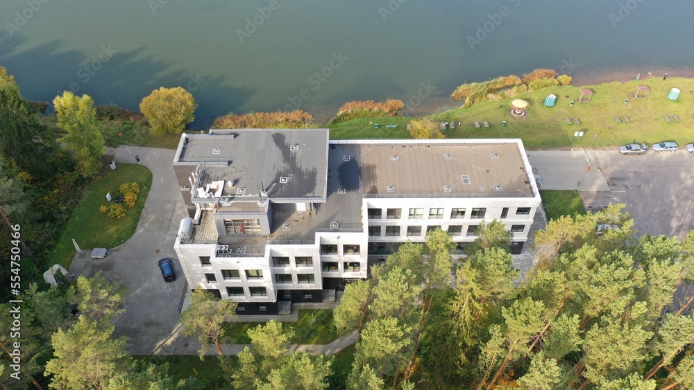 Zhdanovichi, Belarus - 01.10.2022: Modern Belarusian architecture. Office building in a picturesque location on the lake. Office in the forest and park. Ecooffice. Suburb of Minsk Zhdanovichi, Belarus - 01.10.2022: Modern Belarusian architecture. Office building in a picturesque location on the lake. Office in the forest and park. Ecooffice. Suburb of Minsk