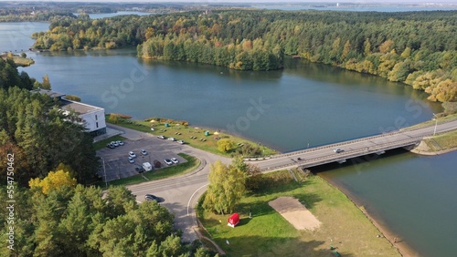 Zhdanovichi, Belarus - 01.10.2022: Bridge across the Drozdy reservoir near Minsk. Cars drive over the bridge. Bridges of Belarus. Recreational zone Zhdanovichi near Minsk.