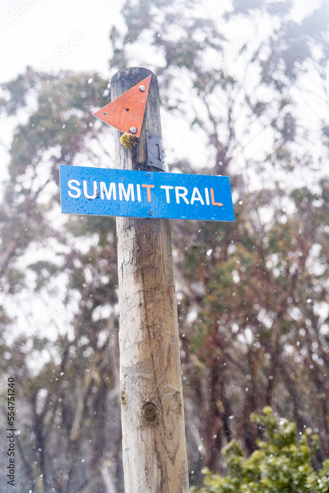 Summit trail sign in the snow, winter, of mt Baw Baw
