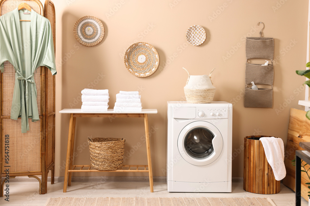 Stylish laundry room with modern washing machine. Interior design Stylish laundry room with modern washing machine. Interior design