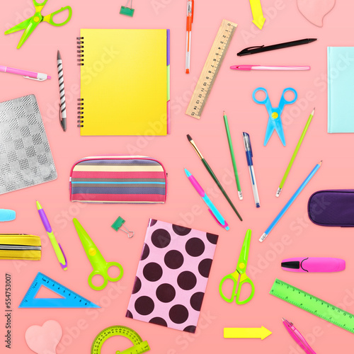 Flat lay composition with different school stationery on pink background